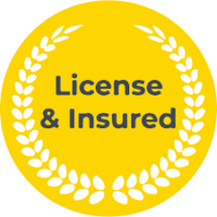 A bright yellow circular badge surrounded by a white laurel wreath, containing the text "License & Insured".